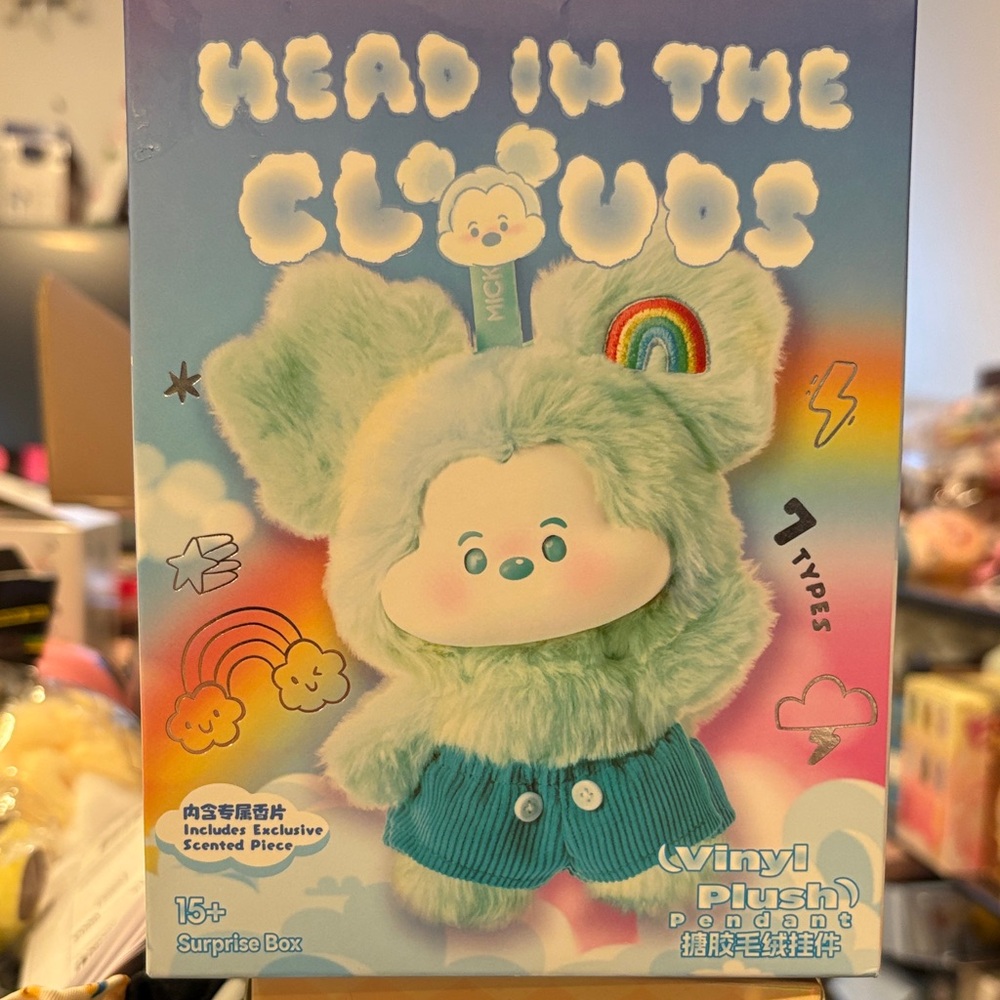 Mini’s Disney Head in the Clouds Vinyl plush opened Leisure Rainbow.